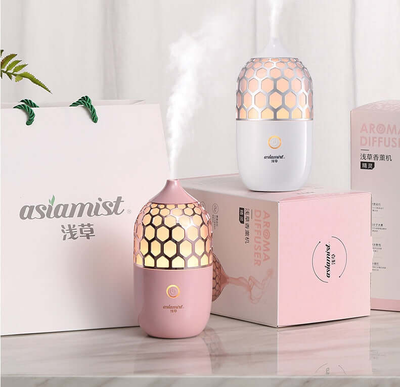 Future Tech Asakusa Pink Aroma Diffuser on a pink background, showcasing its elegant design and aromatherapy function.