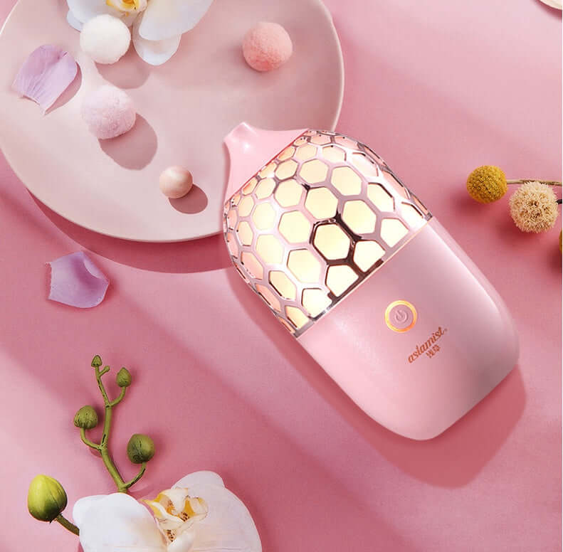 Future Tech Asakusa Pink Aroma Diffuser on a pink background, showcasing its elegant design and aromatherapy function.