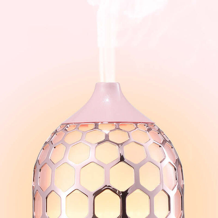 Future Tech Asakusa Pink Aroma Diffuser on a pink background, showcasing its elegant design and aromatherapy function.