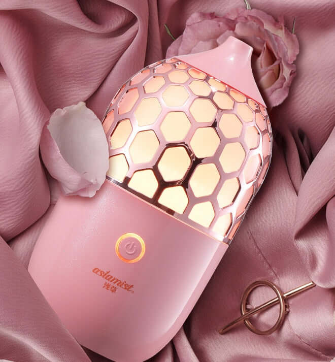 Future Tech Asakusa Pink Aroma Diffuser on a pink background, showcasing its elegant design and aromatherapy function.
