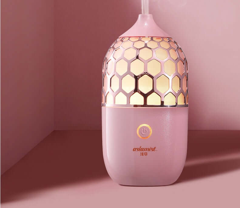 Future Tech Asakusa Pink Aroma Diffuser on a pink background, showcasing its elegant design and aromatherapy function.