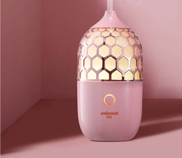 Future Tech Asakusa Pink Aroma Diffuser on a pink background, showcasing its elegant design and aromatherapy function.