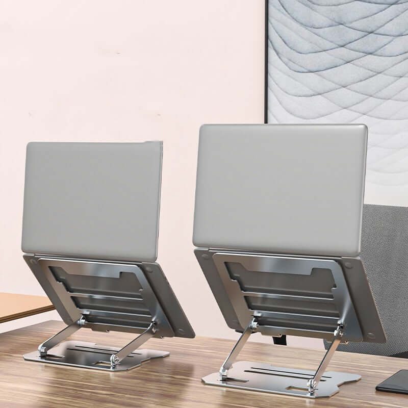 Future Tech Two portable laptop folding stands on a desk showcasing their sleek and minimalist design in silver and black.